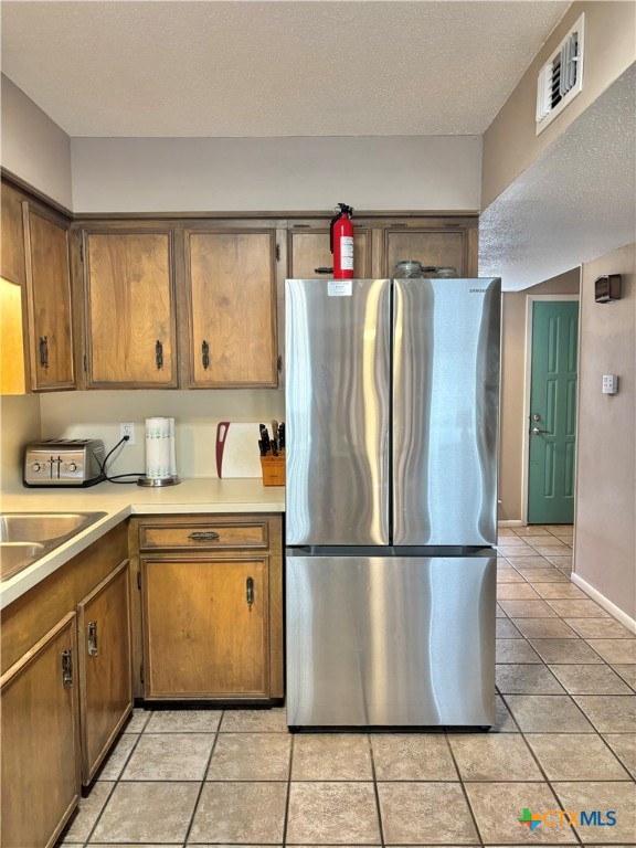 454 15th Street Port O'Connor, TX 77982 - Photo 4 of 45 a white refrigerator freezer sitting inside of a kitchen