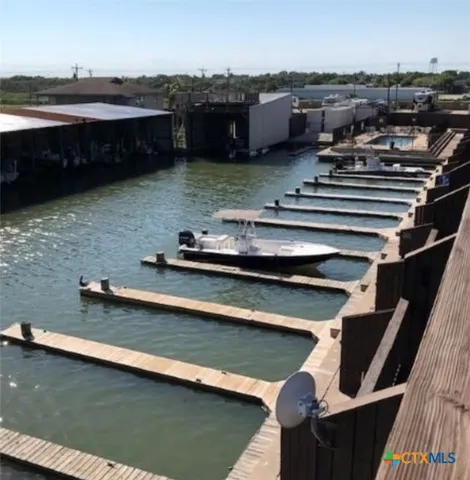 a view of a chairs and table in the back yard of the house