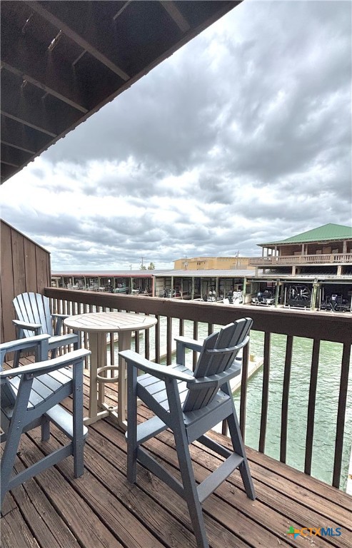 454 15th Street Port O'Connor, TX 77982 - Photo 45 of 45 a view of a balcony with wooden chairs