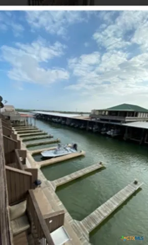 a view of a swimming pool and an outdoor seating