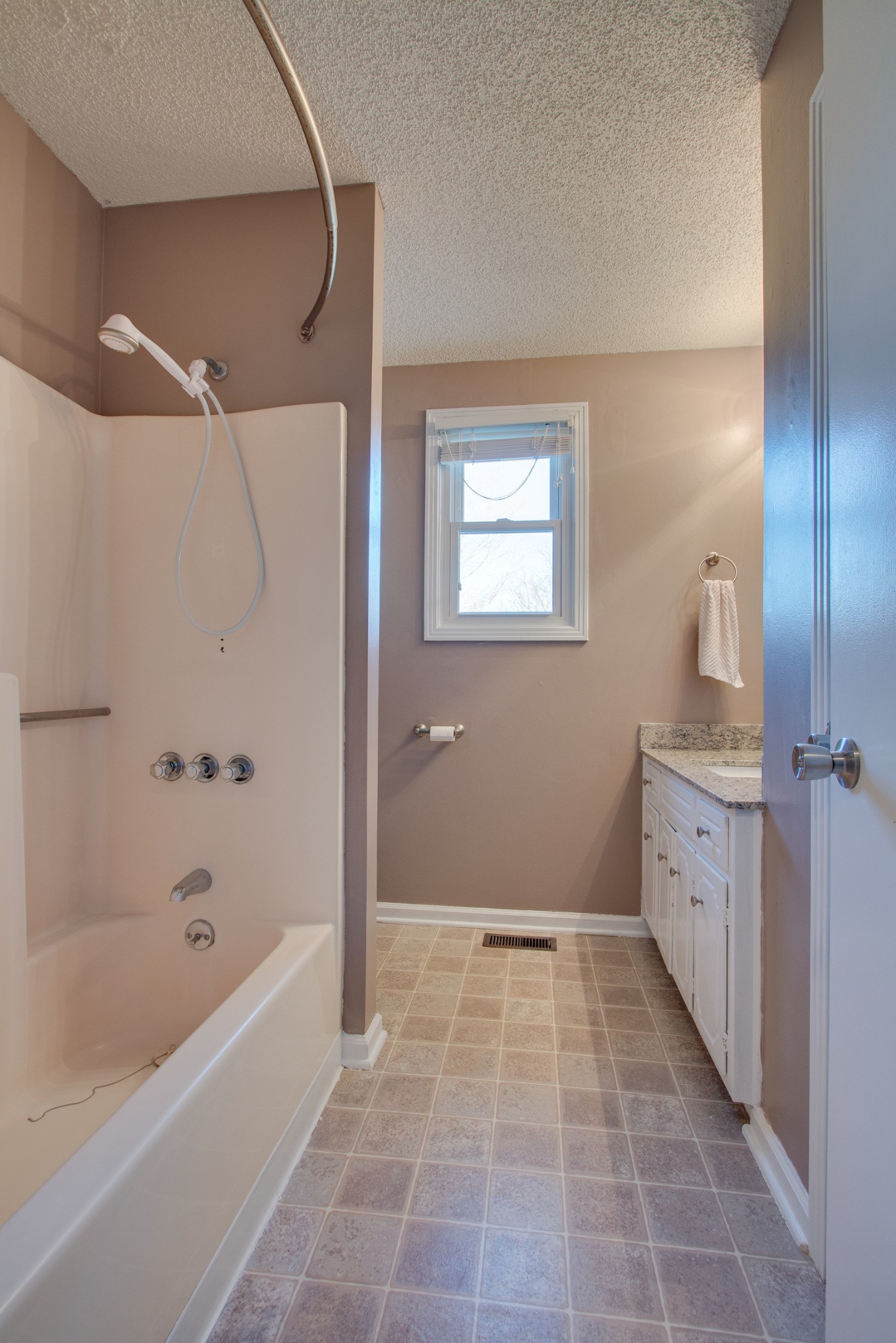 4875 Big Springs Road Lebanon, TN 37090 - Photo 11 of 18 a bathroom with a tub shower vanity and a sink