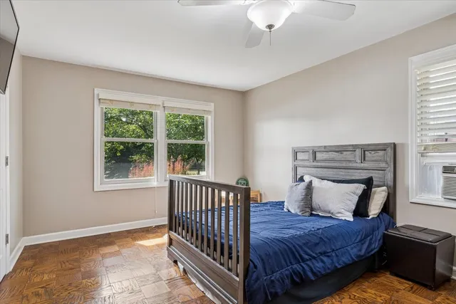 a bedroom with bed and window