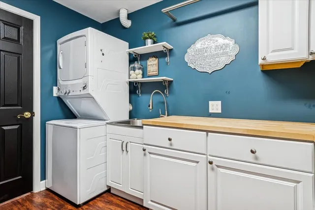 a kitchen with a cabinets and chandelier