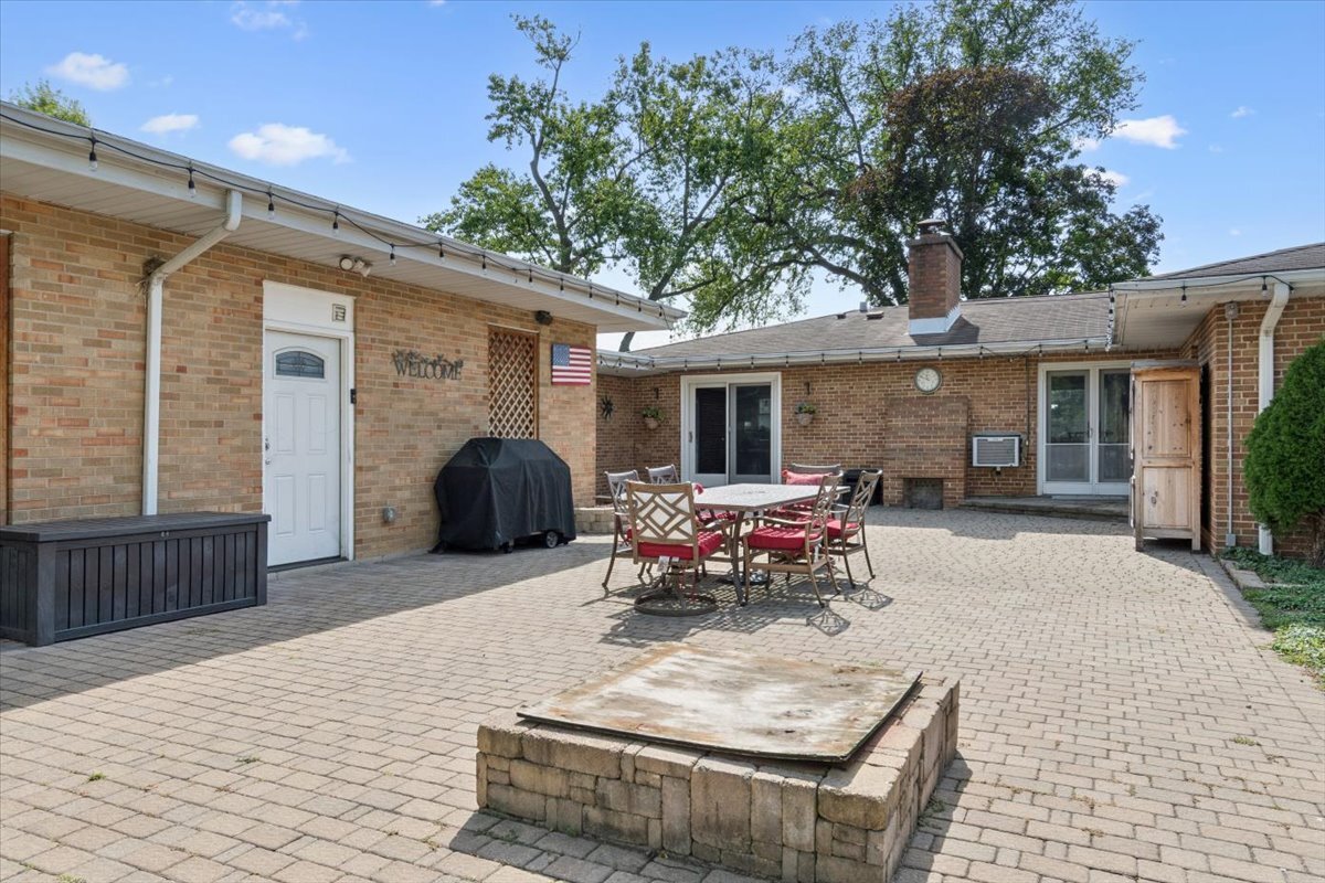 353 East Butterfield Road Elmhurst, IL 60126 - Photo 21 of 25 a front view of house with yard outdoor seating and barbeque oven
