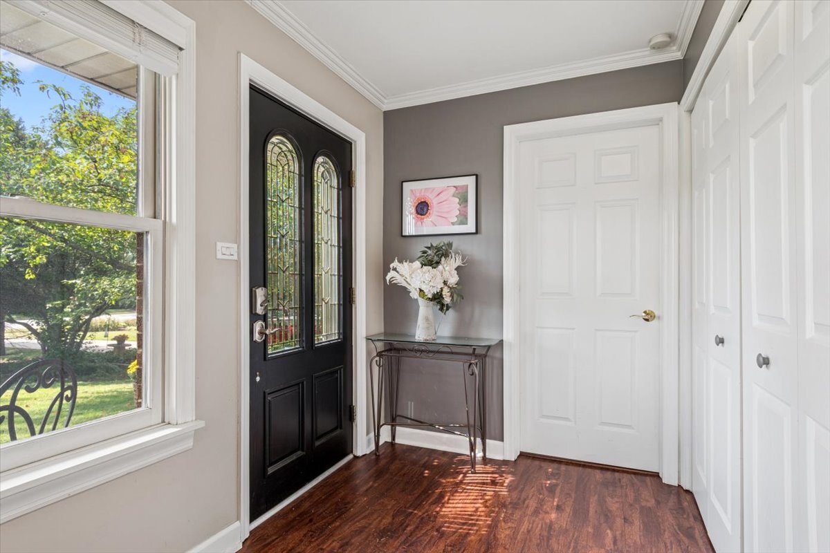 353 East Butterfield Road Elmhurst, IL 60126 - Photo 3 of 25 wooden floor in an empty room with a window
