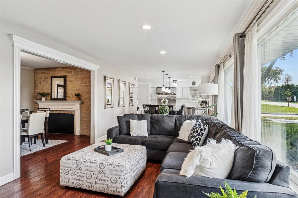 353 East Butterfield Road Elmhurst, IL 60126 - Photo 5 of 25 a living room with furniture and a fireplace