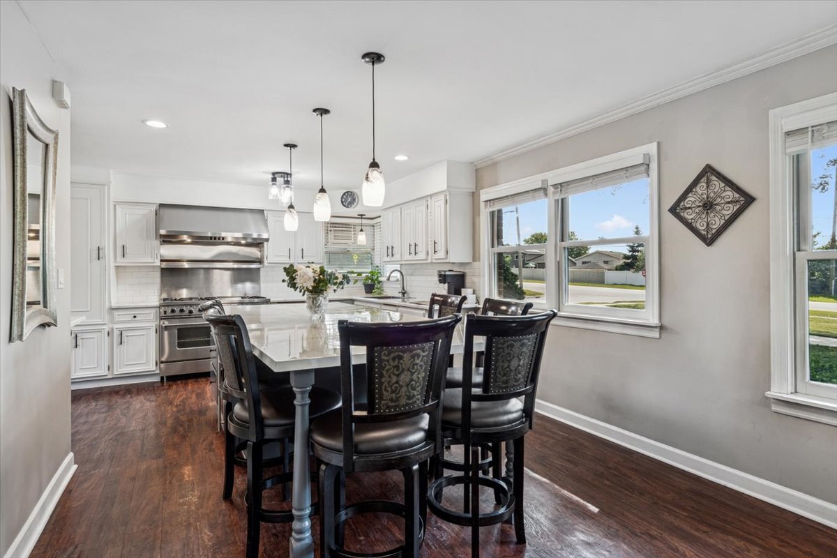 353 East Butterfield Road Elmhurst, IL 60126 - Photo 7 of 25 a view of a dining room and livingroom with furniture wooden floor kitchen chandelier
