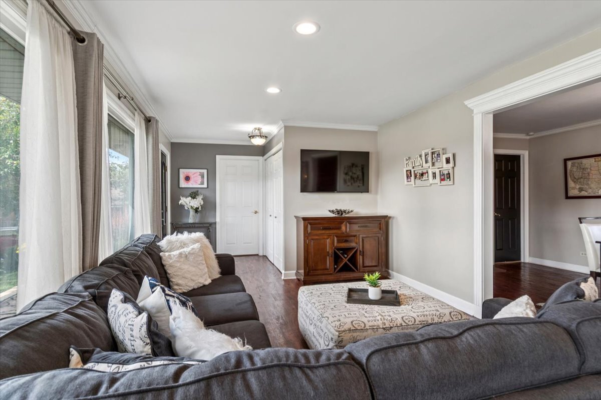 353 East Butterfield Road Elmhurst, IL 60126 - Photo 10 of 25 a living room with furniture fireplace and a flat screen tv