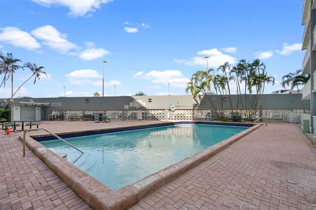 a view of swimming pool with a yard