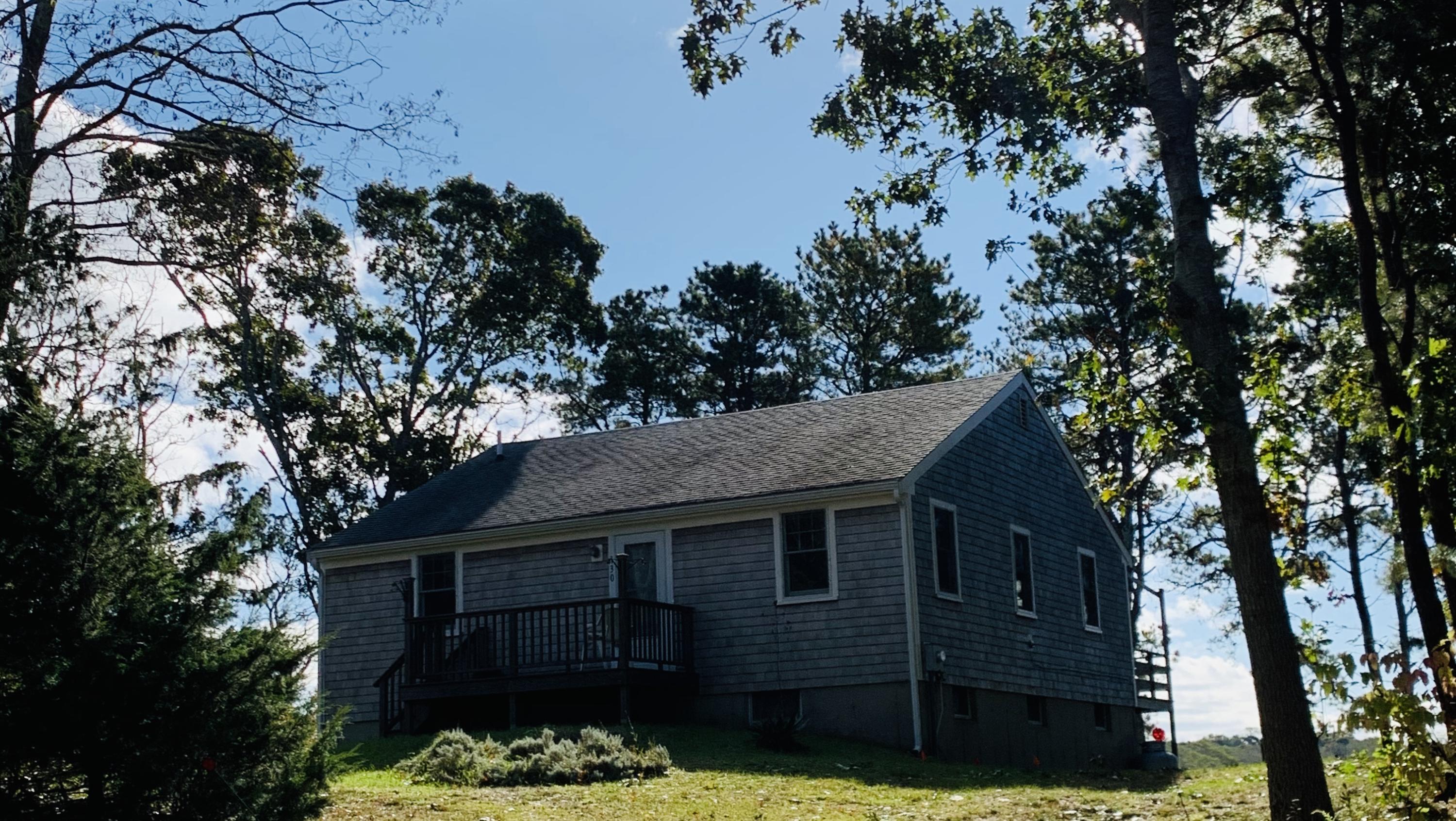 130 Peace Valley Road Wellfleet, MA 02667 - Photo 13 of 28 front view of a house with a tree