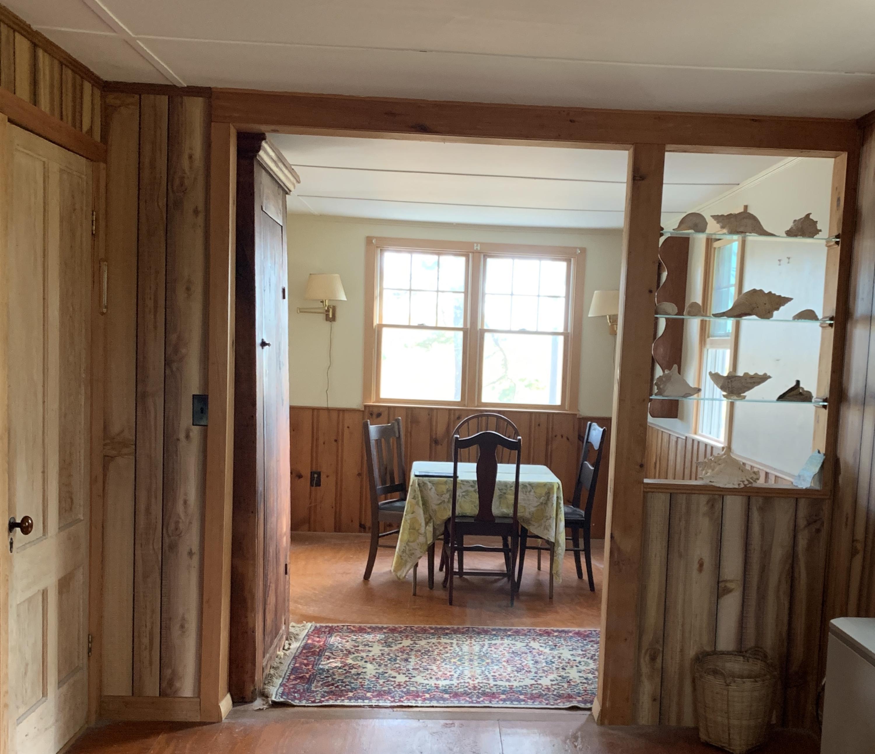 130 Peace Valley Road Wellfleet, MA 02667 - Photo 16 of 28 a view of a livingroom with furniture and windows