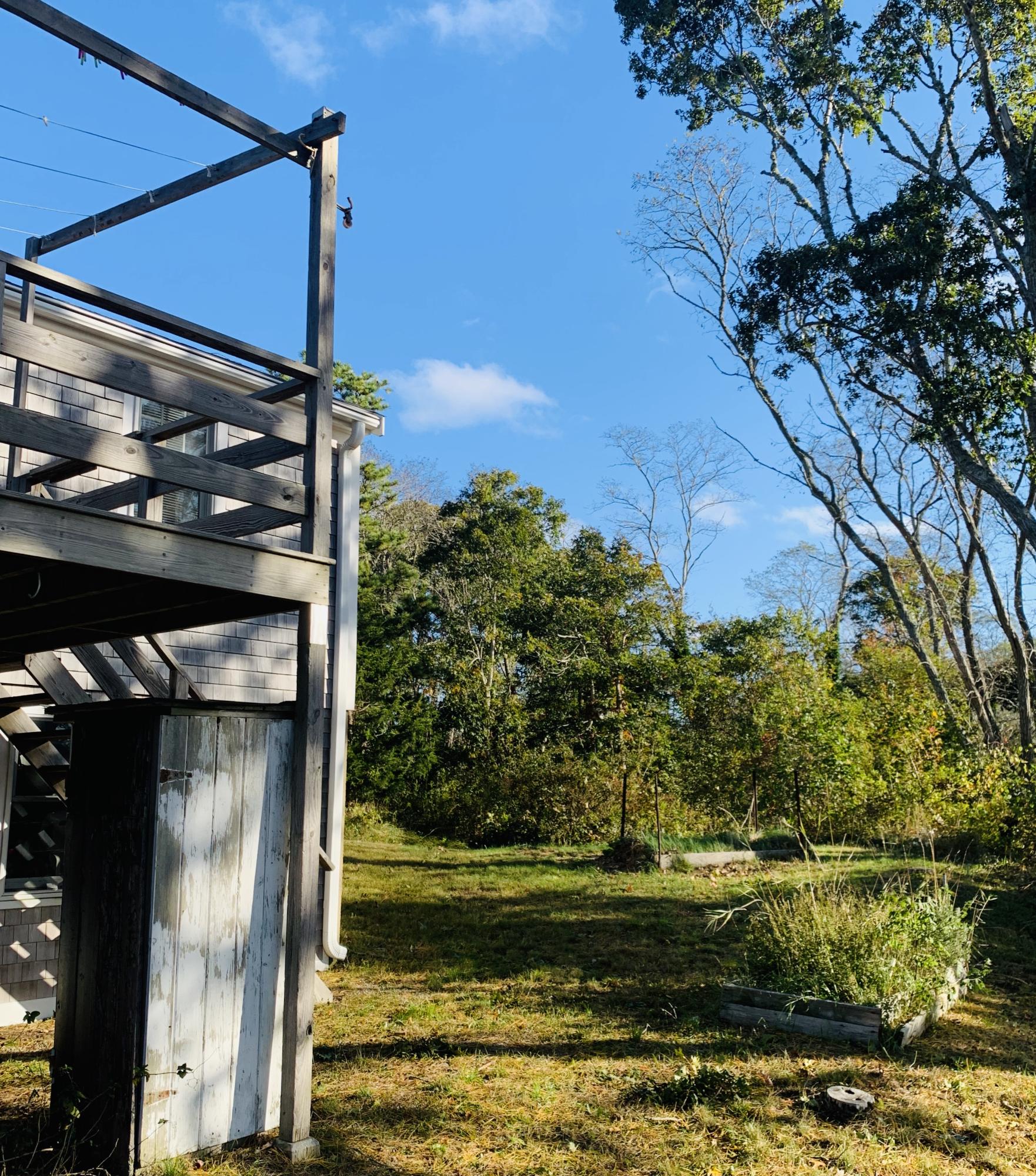 130 Peace Valley Road Wellfleet, MA 02667 - Photo 7 of 28 a view of a small yard