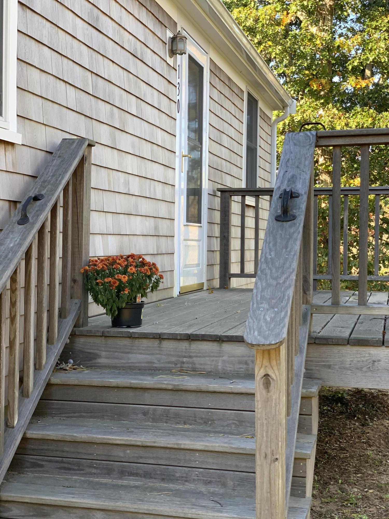 130 Peace Valley Road Wellfleet, MA 02667 - Photo 10 of 28 a view of a house with a potted plant
