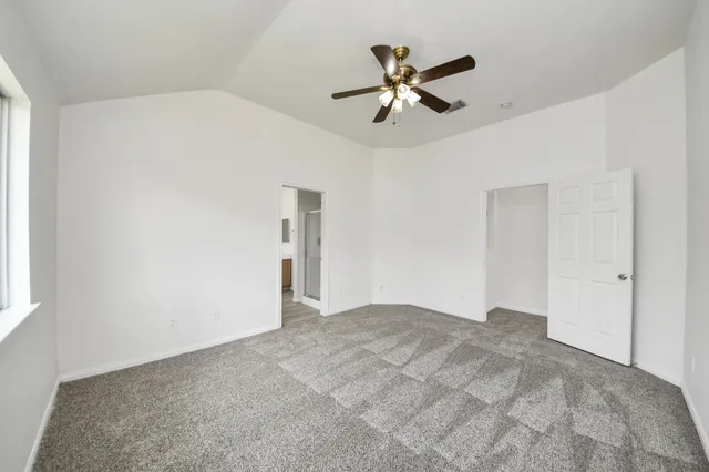 a view of a big room with carpet