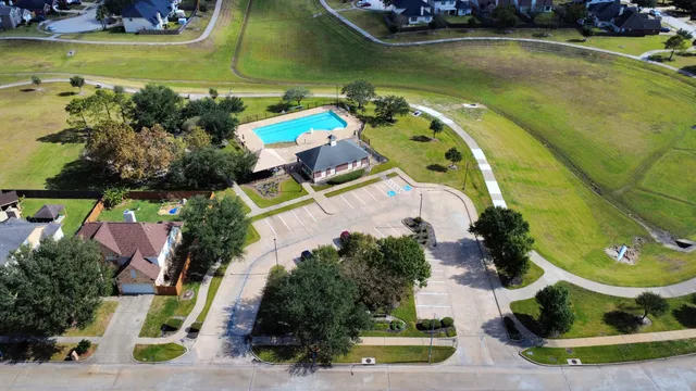 an aerial view of a house with a swimming pool