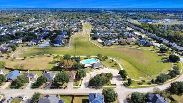 a view of a swimming pool with a table and chairs