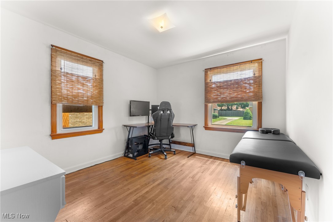 1515 Deville Avenue Northwest Canton, OH 44708 - Photo 13 of 42 Home office with healthy amount of natural light and wood finished floors