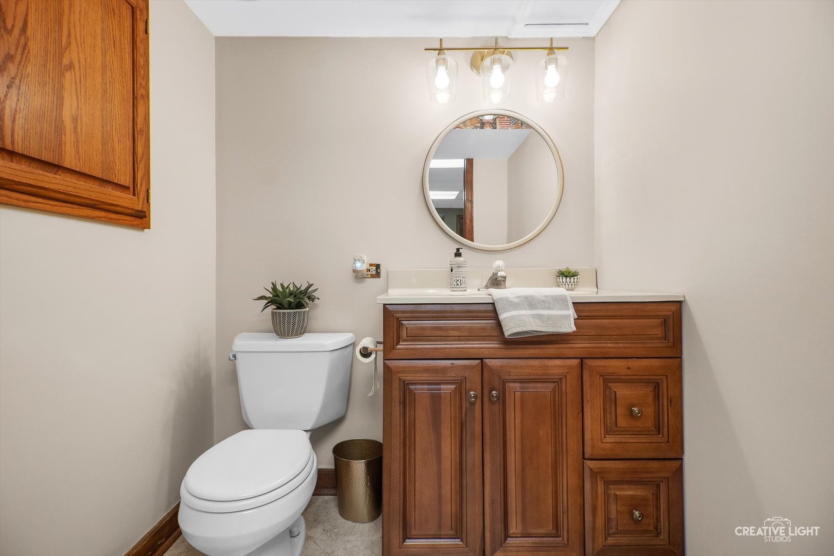 3112 Turnberry Road St. Charles, IL 60174 - Photo 16 of 43 a bathroom with a toilet a sink and a mirror