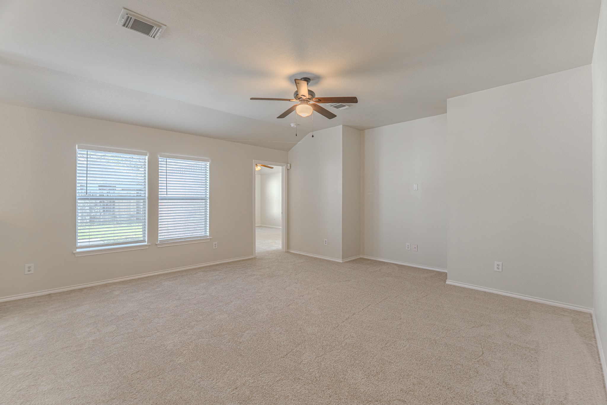 25506 Brisk Spring Court Spring, TX 77373 - Photo 11 of 45 an empty room with windows and fan