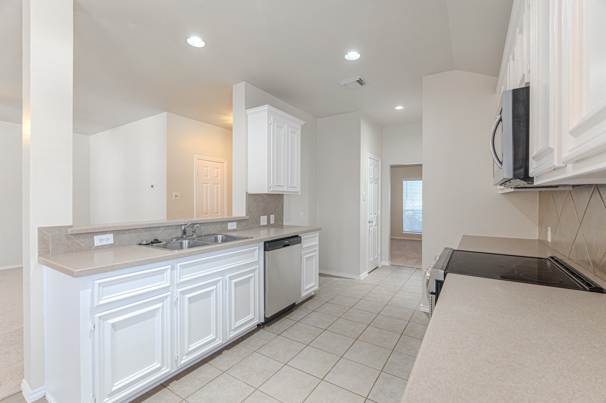 25506 Brisk Spring Court Spring, TX 77373 - Photo 18 of 45 a large bathroom with a double vanity sink and a mirror