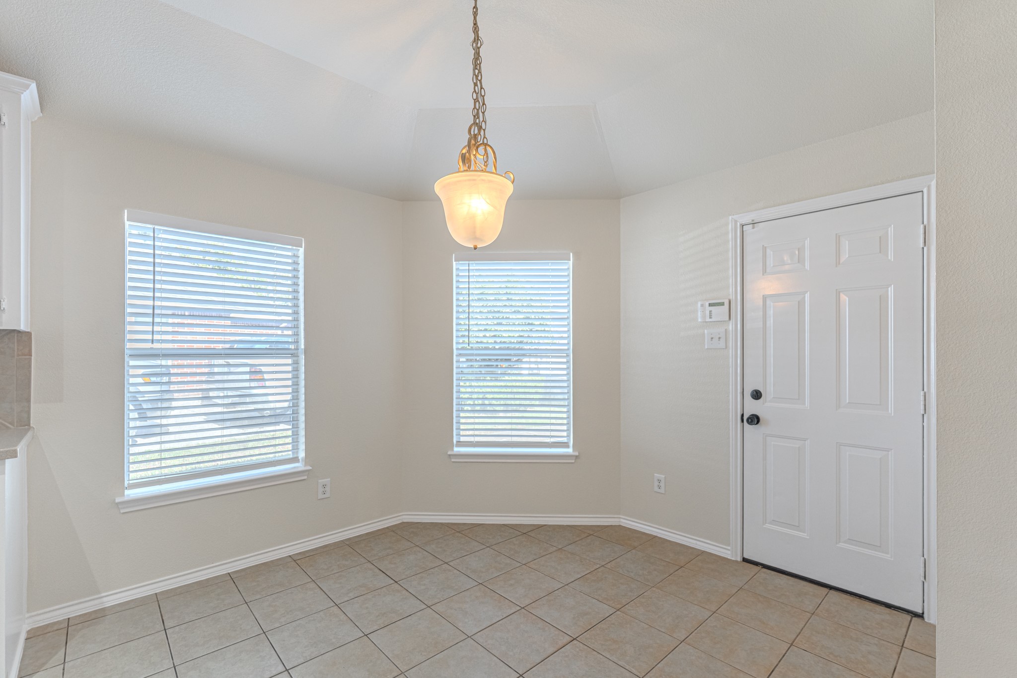 25506 Brisk Spring Court Spring, TX 77373 - Photo 21 of 45 a view of an empty room with window and chandelier fan