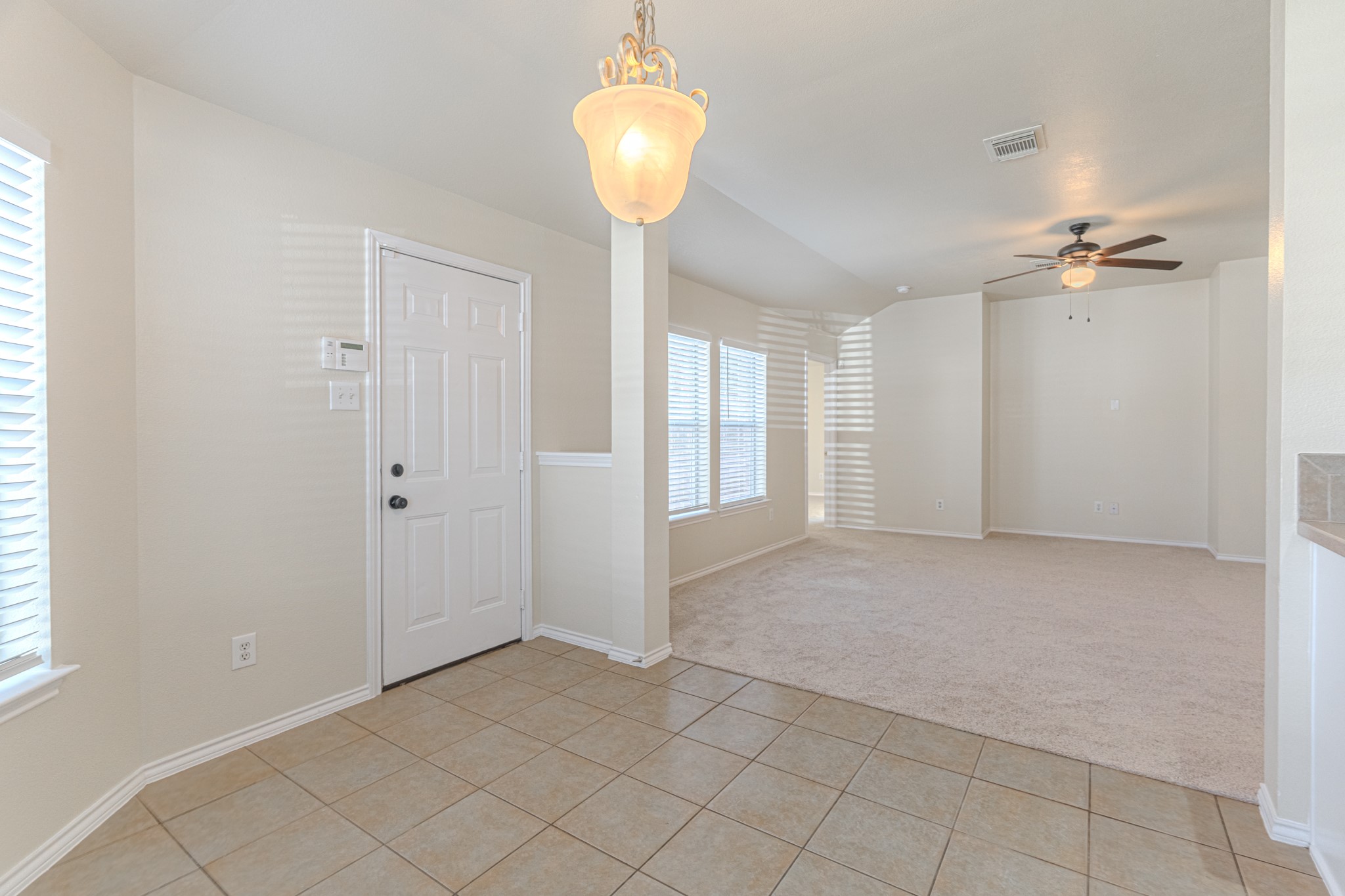 25506 Brisk Spring Court Spring, TX 77373 - Photo 22 of 45 a view of a chandelier fan and entryway