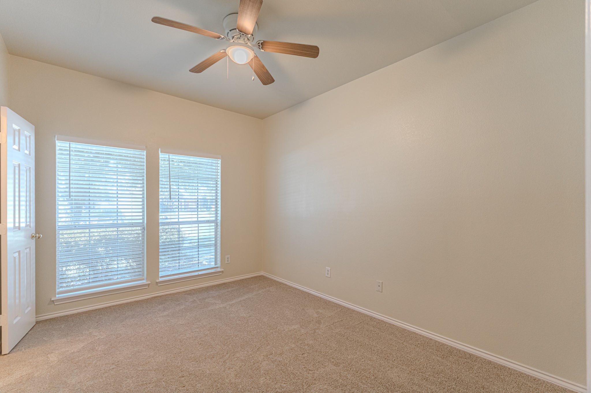 25506 Brisk Spring Court Spring, TX 77373 - Photo 30 of 45 an empty room with windows and fan