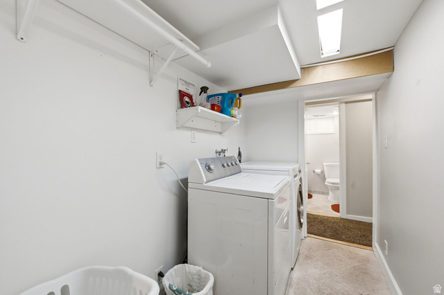 310 East 600 South Centerville, UT 84014 - Photo 22 of 41 Dedicated laundry area featuring white walls, overhead shelving, and a built-in clothing rod
