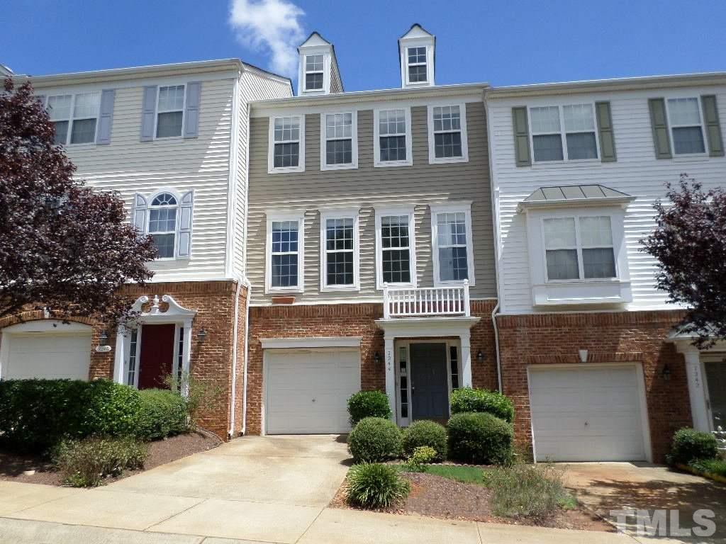 7244 Corvette Court Raleigh, NC 27613 - Photo 1 of 15 a front view of multi story residential apartment building