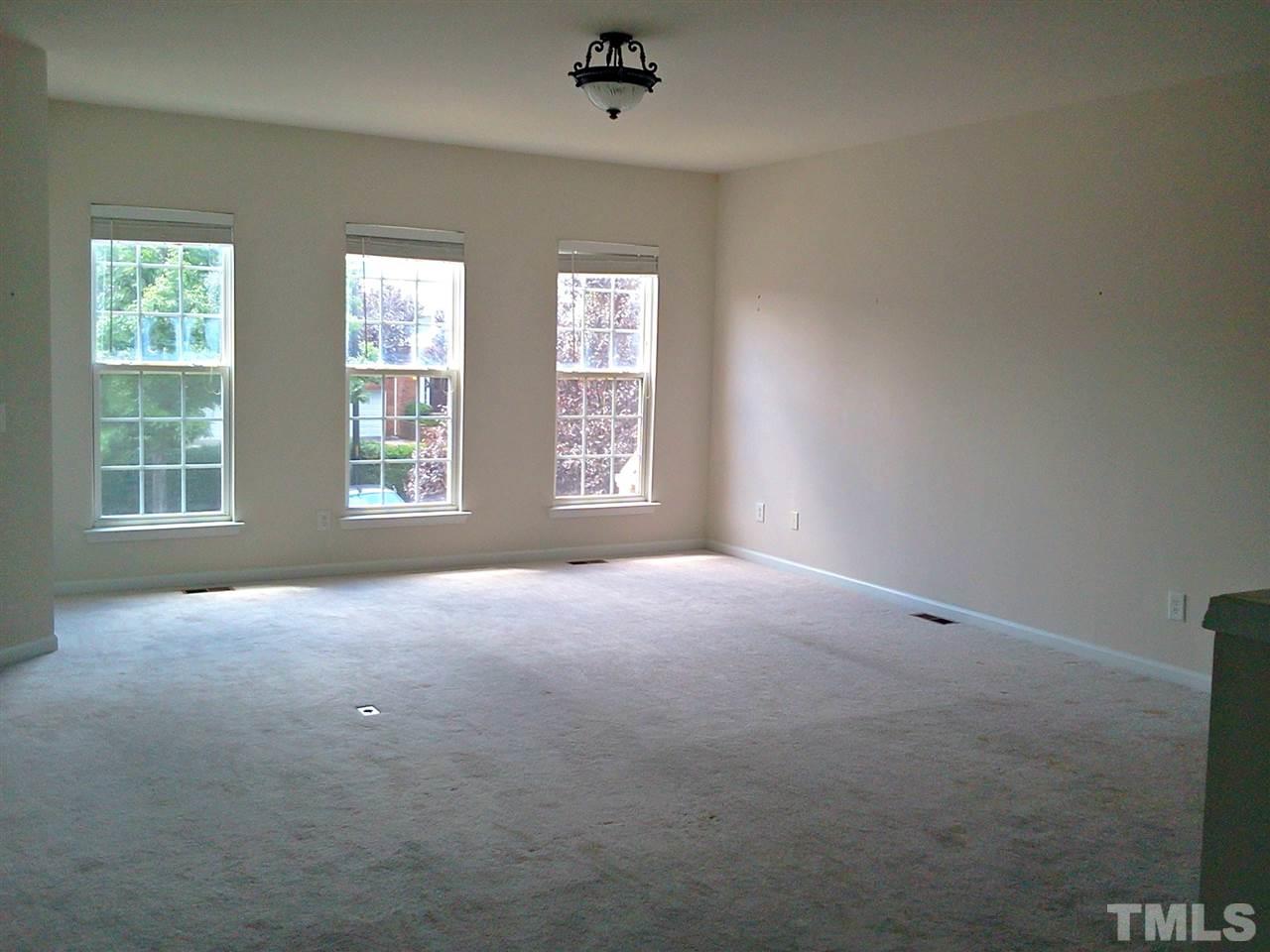 7244 Corvette Court Raleigh, NC 27613 - Photo 12 of 15 an empty room with windows