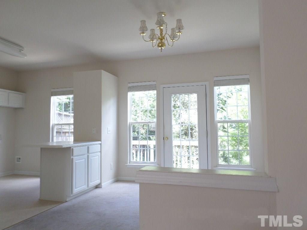 7244 Corvette Court Raleigh, NC 27613 - Photo 5 of 15 a view of an empty room with a window