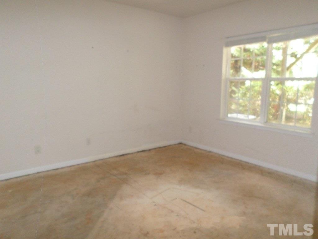 7244 Corvette Court Raleigh, NC 27613 - Photo 9 of 15 an empty room with a window