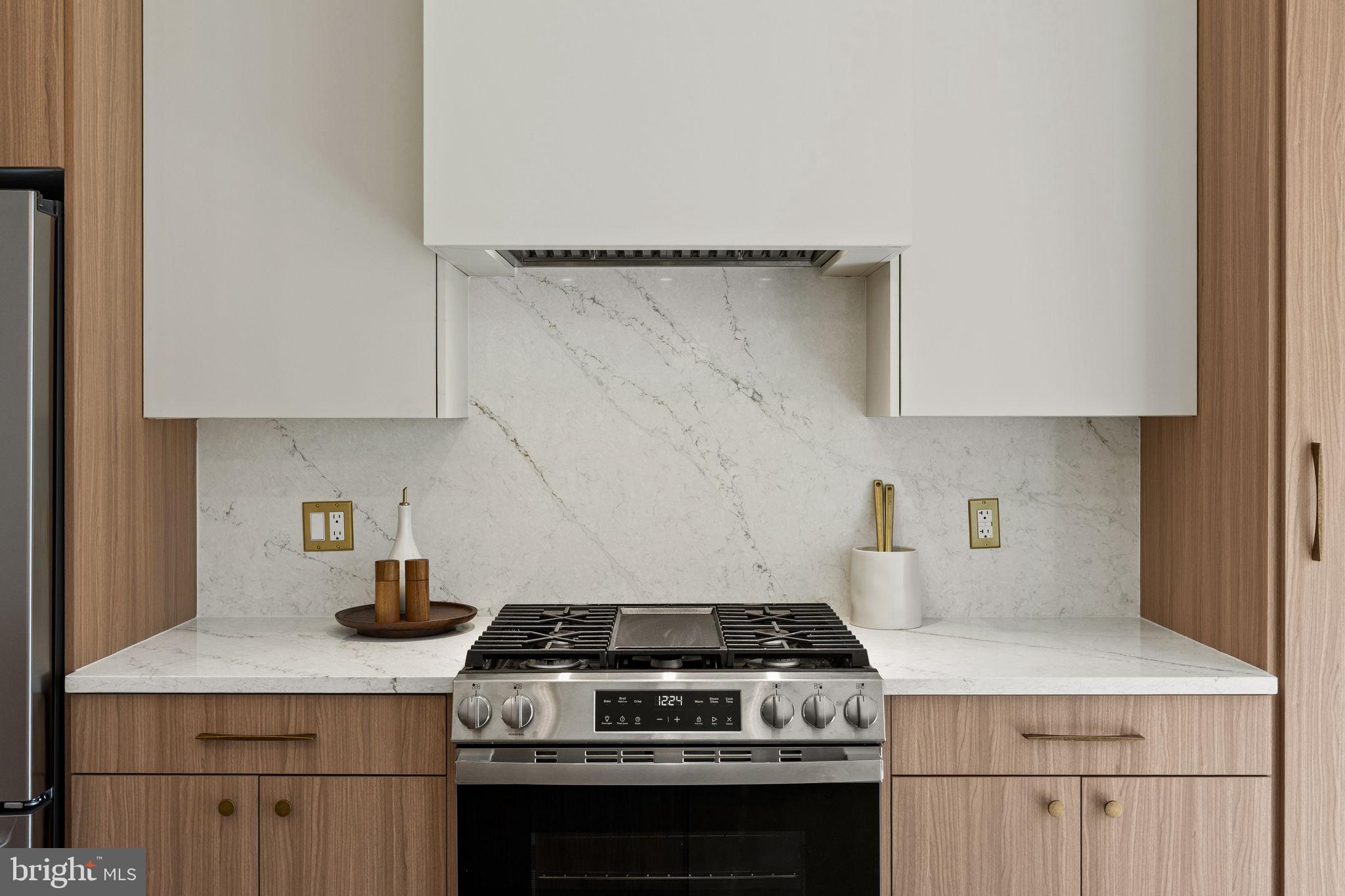 1709 North 4th Street Philadelphia, PA 19122 - Photo 15 of 50 a stove top oven sitting inside of a kitchen