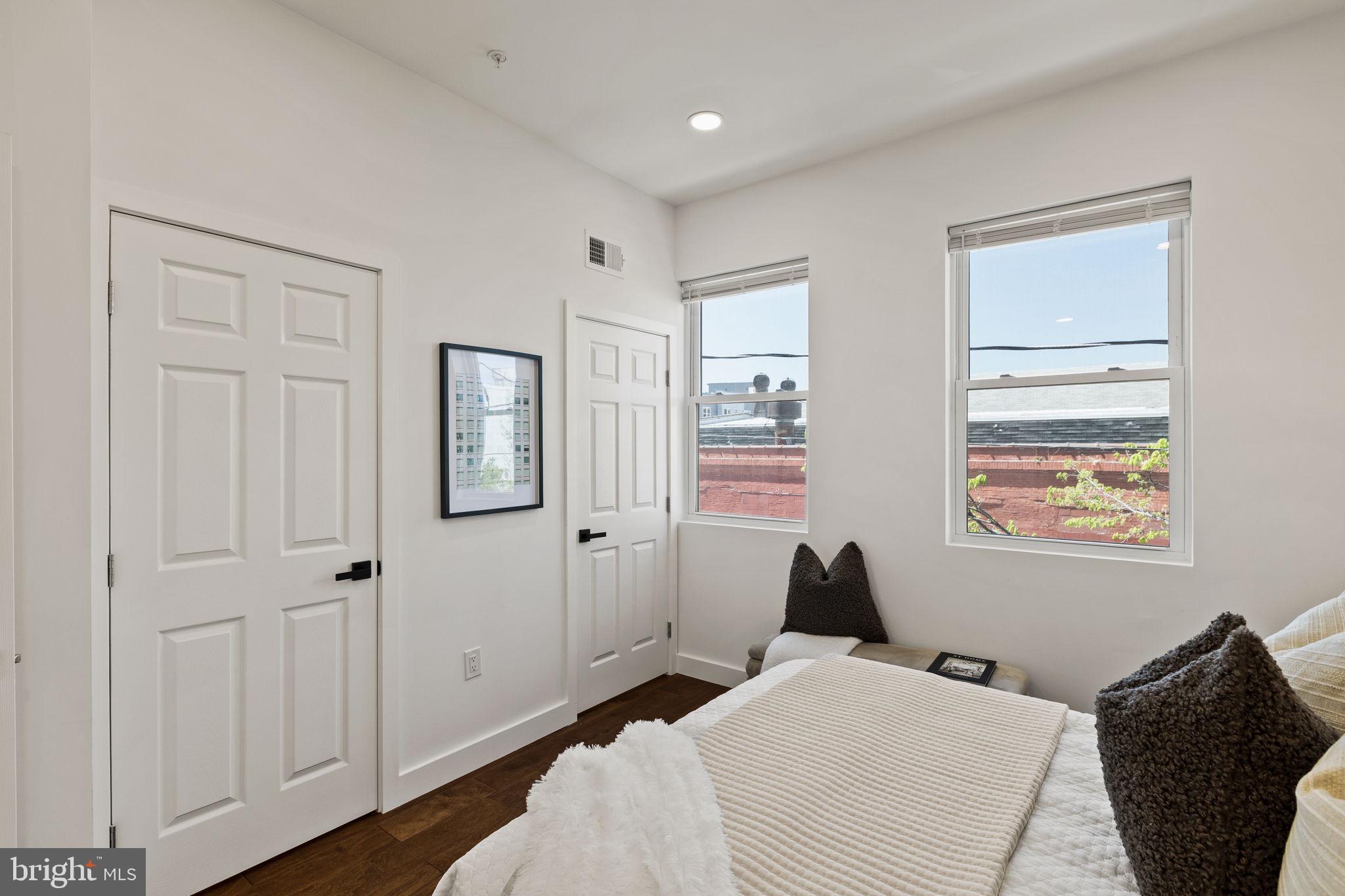 1709 North 4th Street Philadelphia, PA 19122 - Photo 23 of 50 a bedroom with a bed and wooden floor