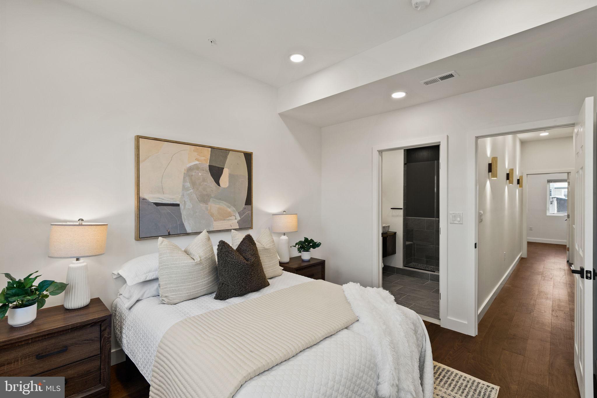 1709 North 4th Street Philadelphia, PA 19122 - Photo 24 of 50 a bedroom with a bed and a lamp