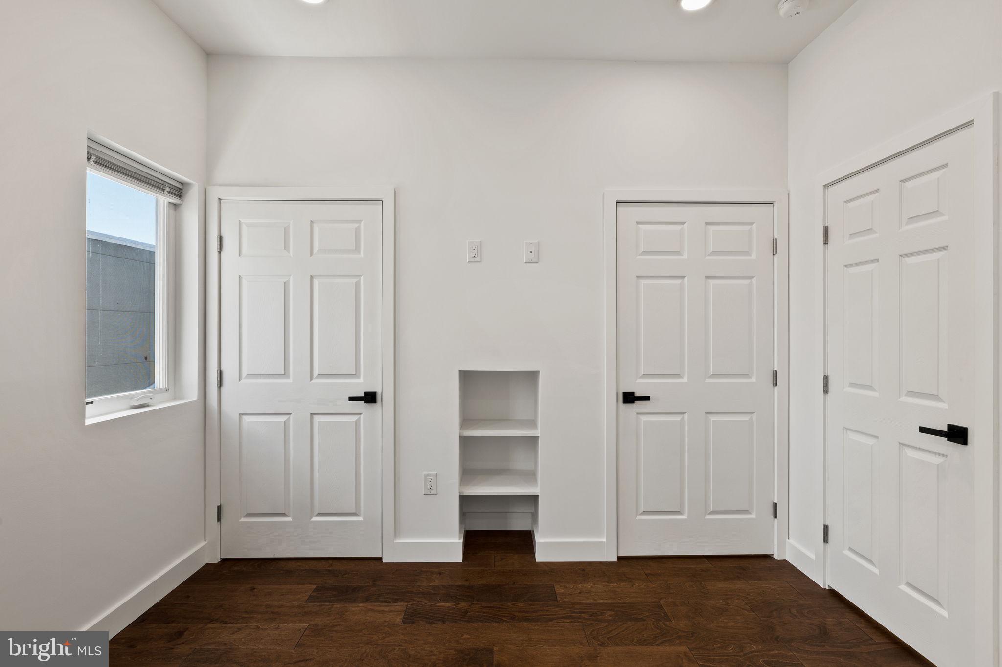 1709 North 4th Street Philadelphia, PA 19122 - Photo 28 of 50 an empty room with wooden floor closet and windows