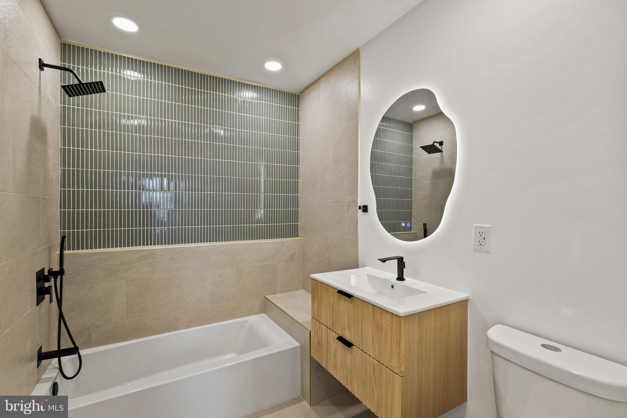1709 North 4th Street Philadelphia, PA 19122 - Photo 30 of 50 a bathroom with a sink a toilet and shower