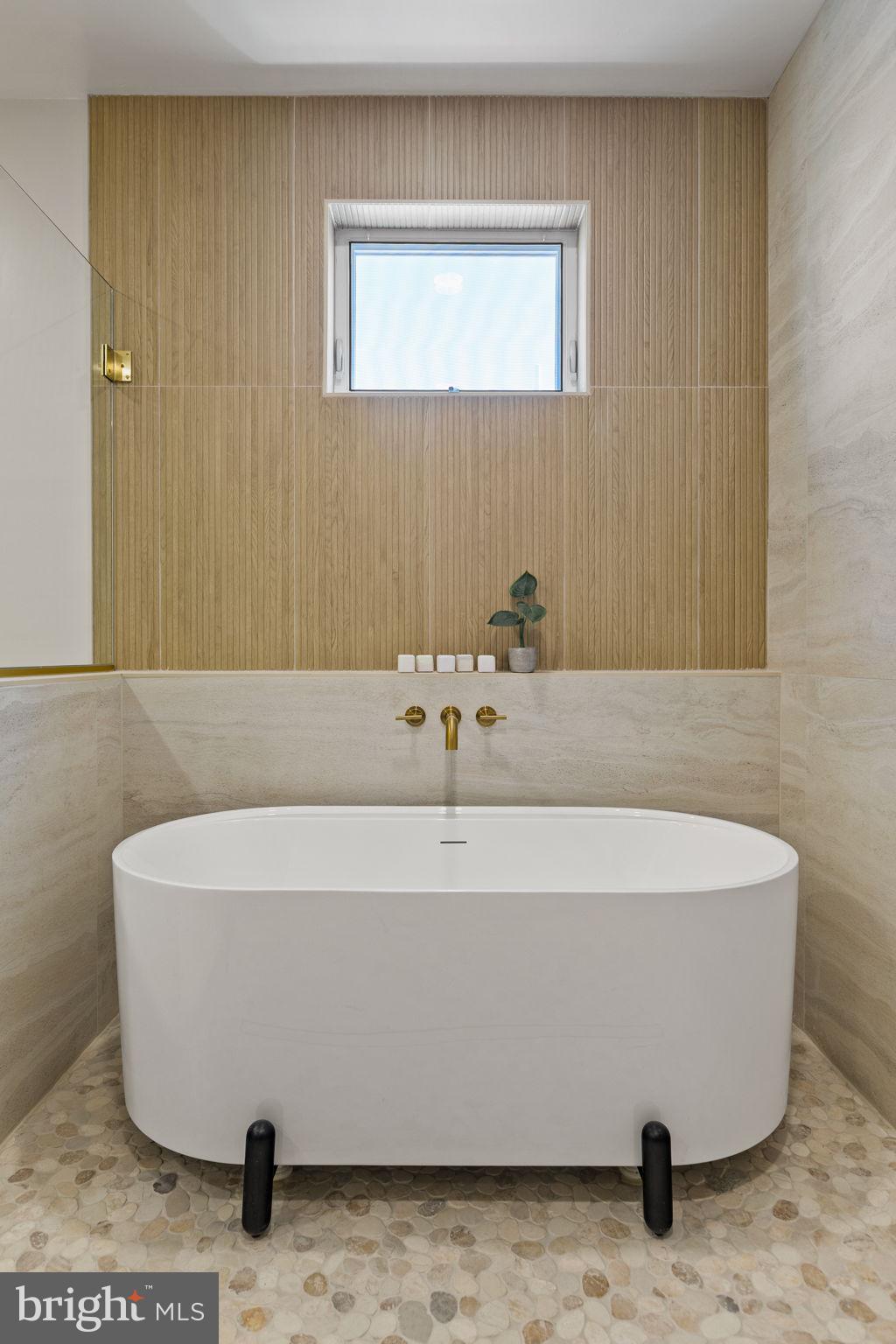 1709 North 4th Street Philadelphia, PA 19122 - Photo 39 of 50 a white bath tub sitting in a bathroom