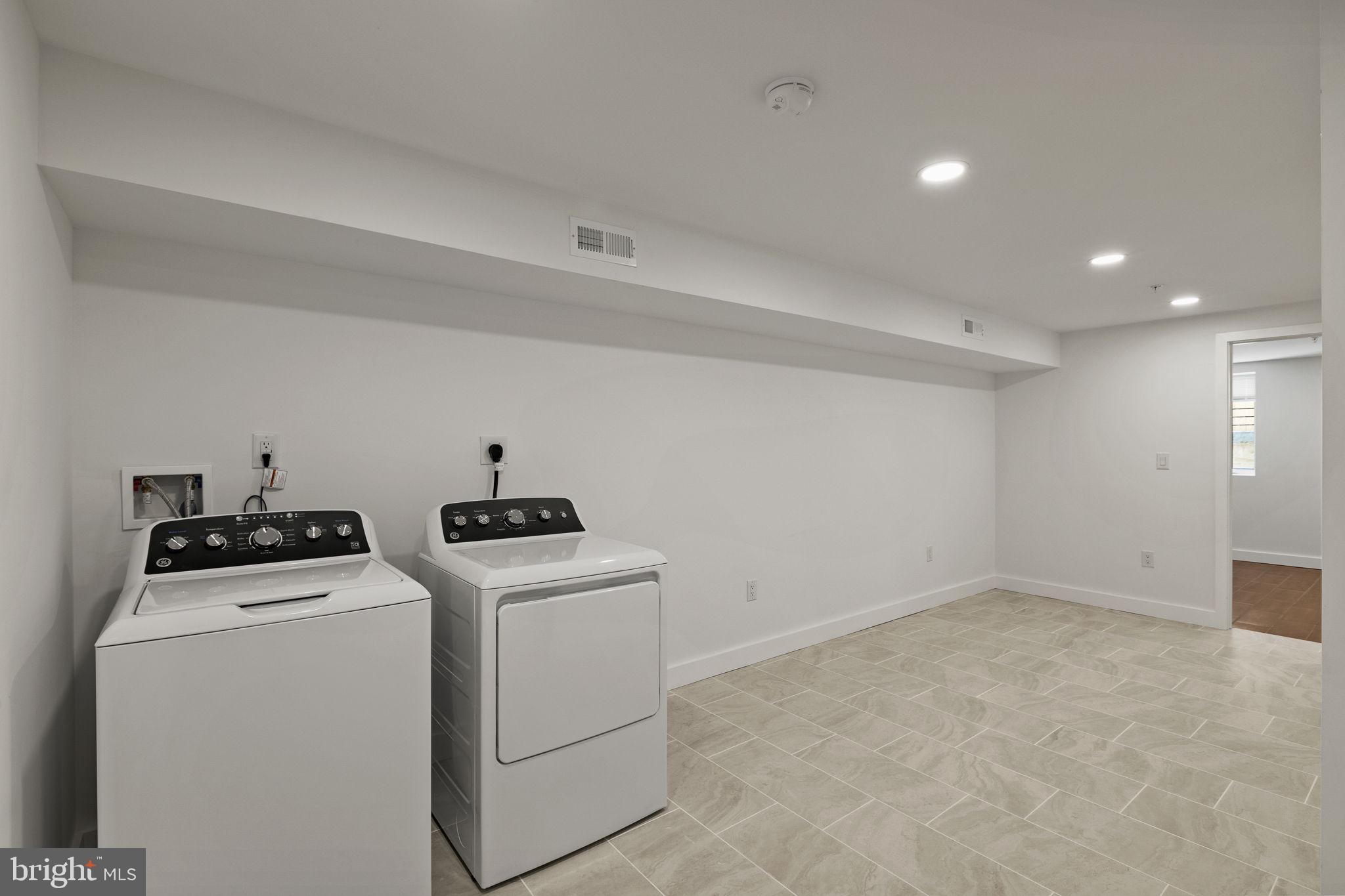 1709 North 4th Street Philadelphia, PA 19122 - Photo 44 of 50 a view of storage and utility room with washer and dryer