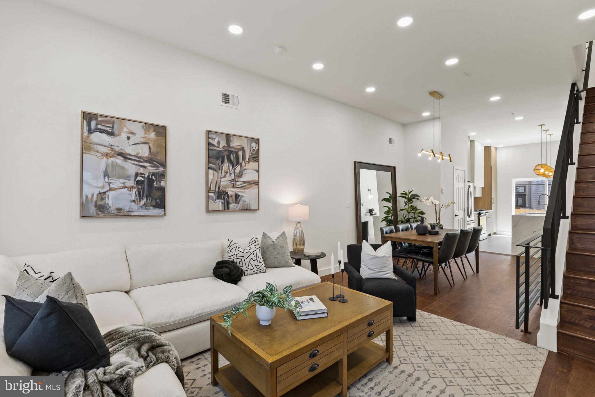 1709 North 4th Street Philadelphia, PA 19122 - Photo 6 of 50 a living room with furniture potted plant and kitchen view