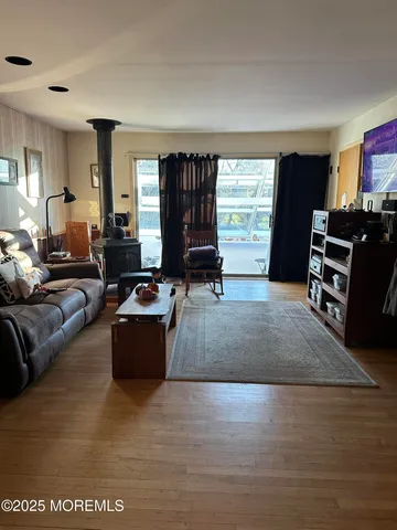 a living room with furniture window and wooden floor