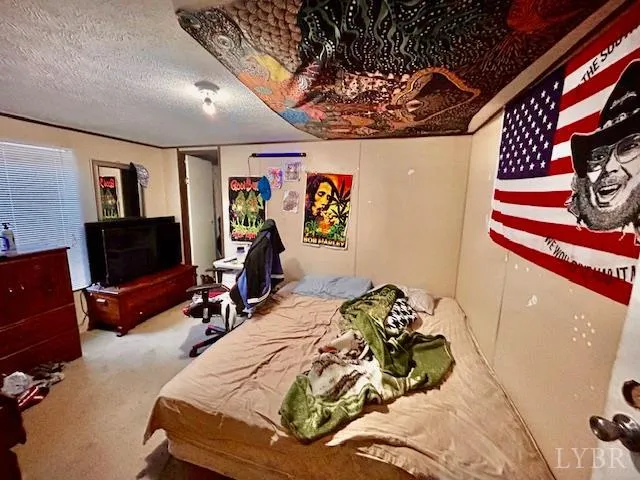 a bedroom with a bed and furniture