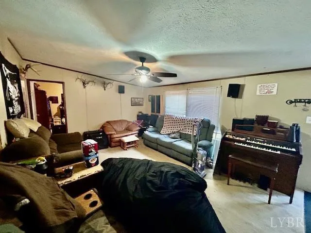 a bedroom with furniture and a piano