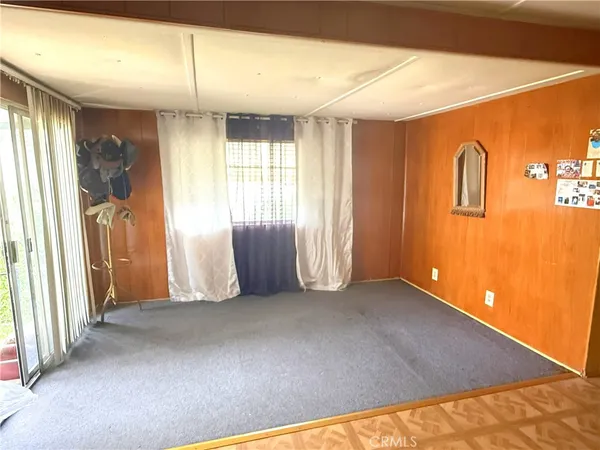 a view of an empty room and a window
