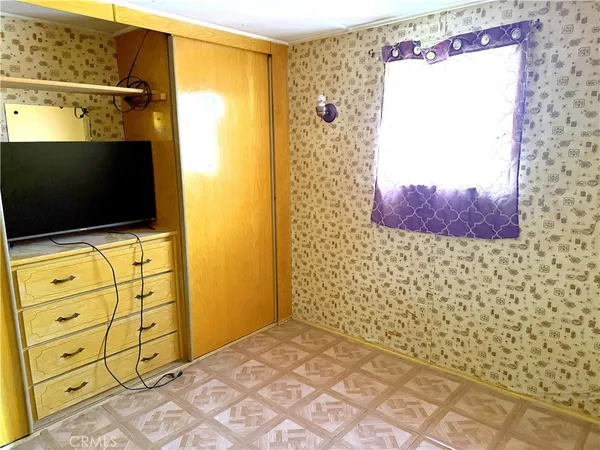 a bathroom with a shower and a sink