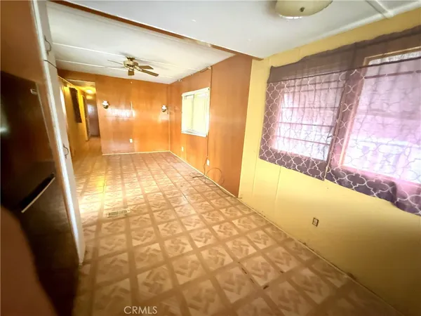 a view of an empty room and window