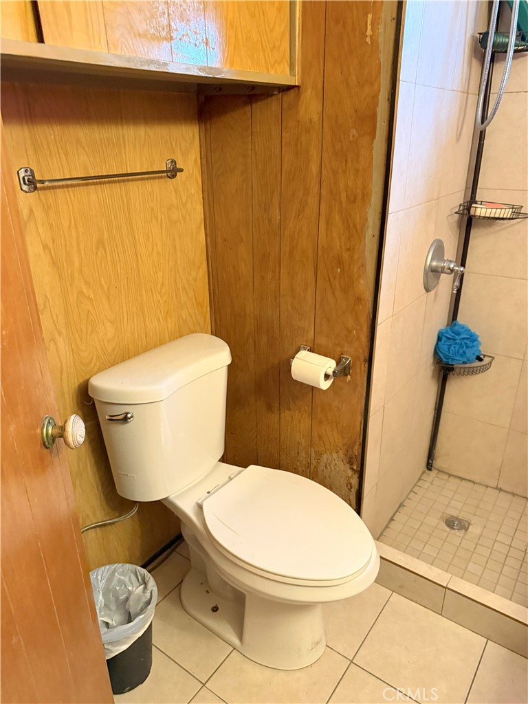 185 North Eucalyptus Avenue, Unit 53 Rialto, CA 92376 - Photo 24 of 38 a white toilet sitting next to a bath tub and a shower