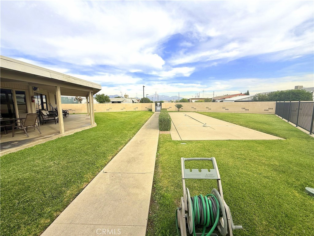 185 North Eucalyptus Avenue, Unit 53 Rialto, CA 92376 - Photo 29 of 38 a view of swimming pool with seating area