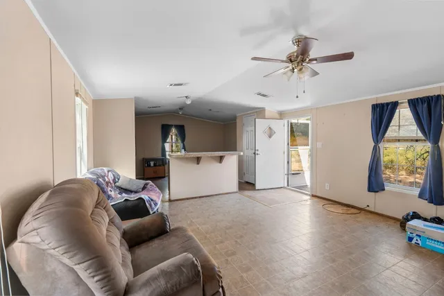 a living room with furniture and window