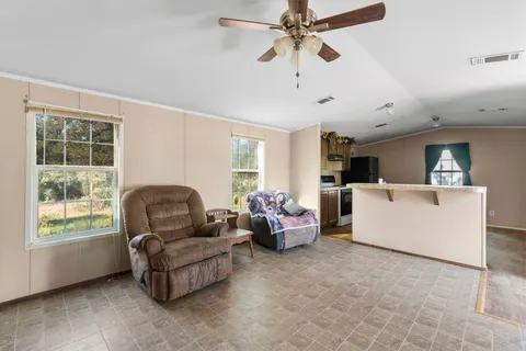 a living room with furniture and a window